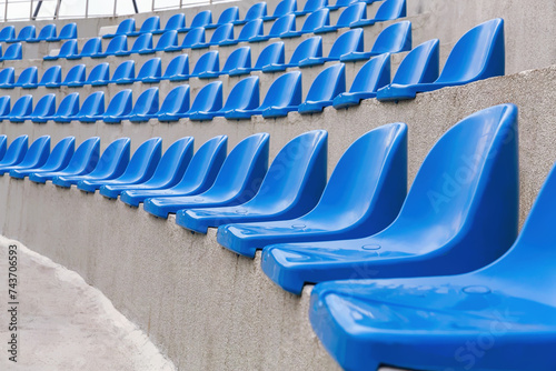 Obraz na plátne Plastic blue seats on street auditorium or stadium