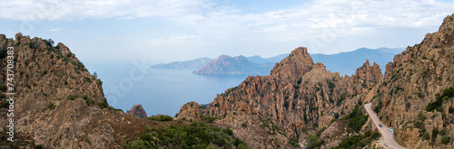 Drone photography of Calanches Piana and Porto ota city with rock cliffs and turquoise waters in Cap Corse