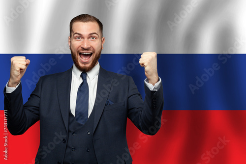 Russian happy businessman on the background of flag of Russia. Business, education, degree and citizenship concept photo