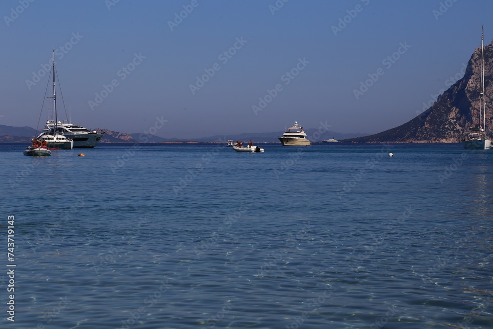 Yacht and boats in Capo Coda Cavallo beach near San Teodoro in Sardinia, Italy