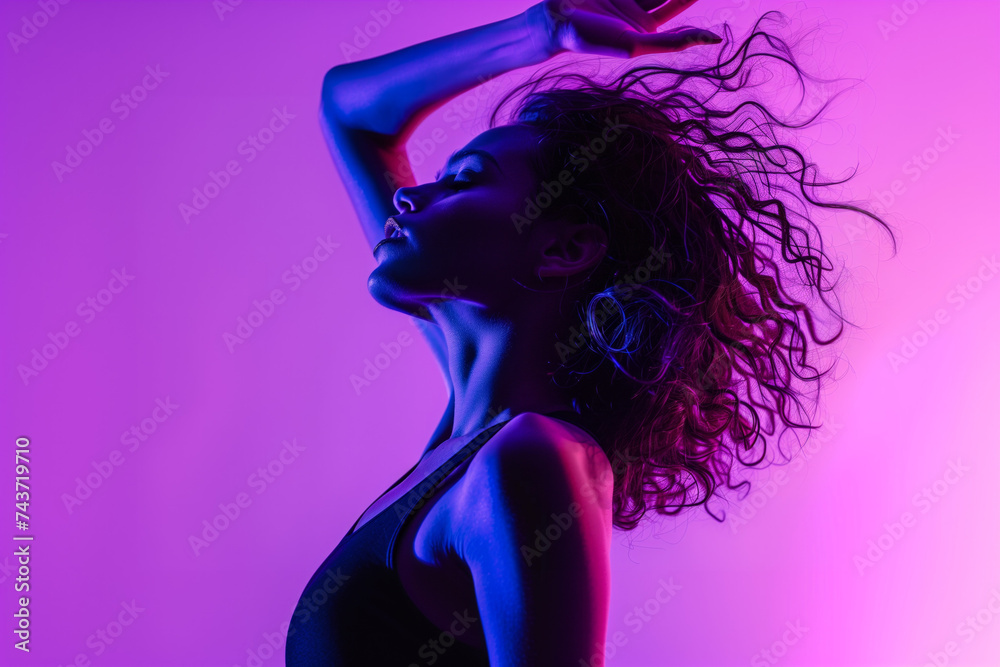 Aesthetic of dance. A beautiful girl dances. Dance art in violet and purple hues.