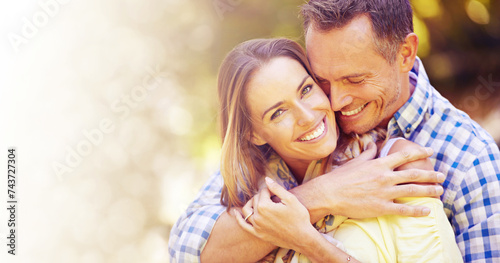 Portrait, hug and couple in park for summer romance, trees and fun outdoor date with mockup space. Love, mature man and happy woman in garden with morning sunshine, hug and marriage bonding in nature