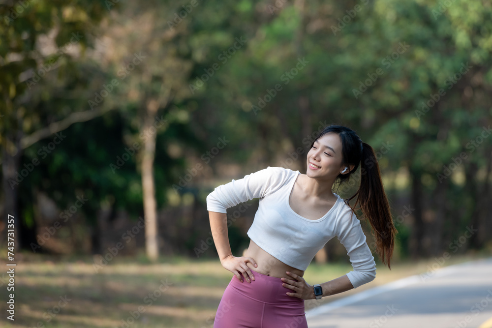 Woman in exercise clothes stretching to prepare muscles before exercising. Woman in exercise clothes stretching to prepare muscles before exercising.