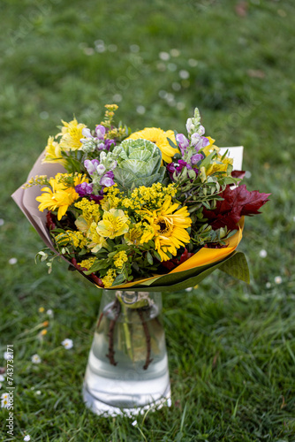 Gorgeous Birthday bouquet featuring yellow Gerberas and other yellow, purple flower. Bouquet photographed from above. Also usable as a floral background. 
