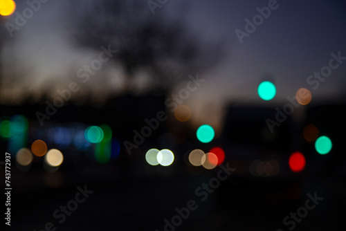 bokeh abstract background of traffic jam in the city at night, headlights of cars selective focus