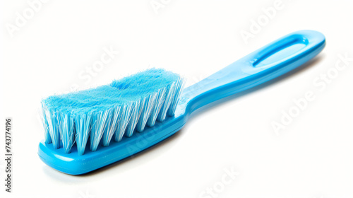 New brush with a blue plastic handle.