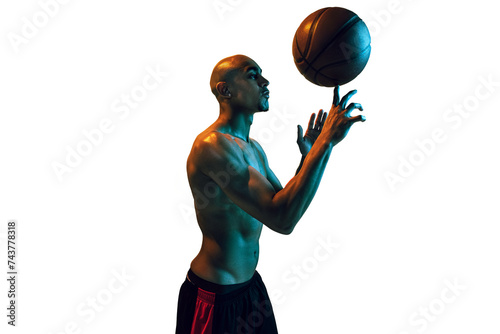 Muscular young man, shirtless basketball player spinning ball on fingertip isolated on transparent background. Concept of sport, competition and tournament, health