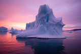 Antarctic Iceberg in ocean at pink sunset sky. Danger and global warming concept.