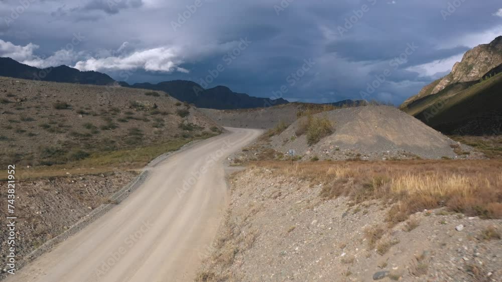 Dirt route crossroads at natural highland cliff valley with dramatic sky landscape drone shot. Offroad destination extreme path highway for transportation at rocky terrain cloudscape Dirt route crossroads at natural highland cliff valley with dramatic sky landscape drone shot. Offroad destination extreme path highway for transportation at rocky terrain cloudscape