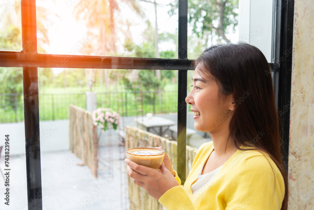 Relax like an Asian woman drinking hot coffee Relax like an Asian woman drinking hot coffee