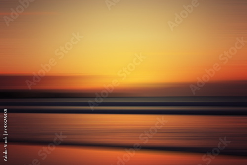 Sunset colors on ocean horizon, motion blur. Abstract background that looks like sunset sky and sea at the sunset