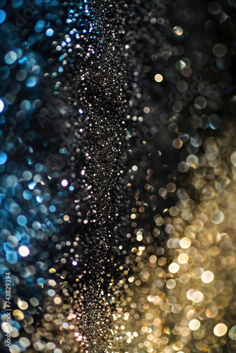 Vertical Glitter vintage lights background. gold, silver, blue and black. de-focused.