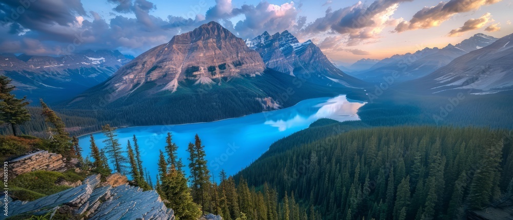 Obraz premium The azure blue waters of Peyto Lake, Canada, nestled like a sapphire gem amidst the rugged wilderness of Banff National Park