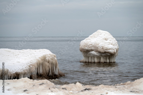 Fototapeta Naklejka Na Ścianę i Meble -  Seascape depicting landscape of Baltic sea and beach with ice and snow formations