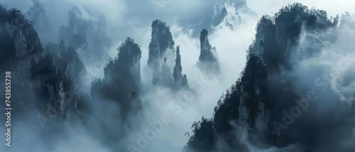 The otherworldly landscapes of Wulingyuan Scenic Area, China, where towering sandstone pillars pierce the mist-filled valleys below © Artem