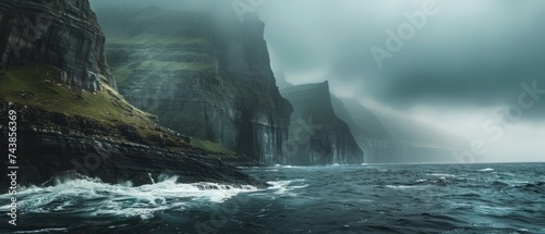 The rugged beauty of the Faroe Islands, Denmark, where dramatic cliffs plunge into the swirling waters of the North Atlantic photo