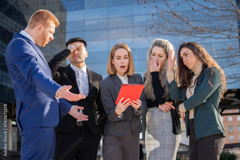 Obraz premium Upset corporate executives with negative expressions after bad news outside their office