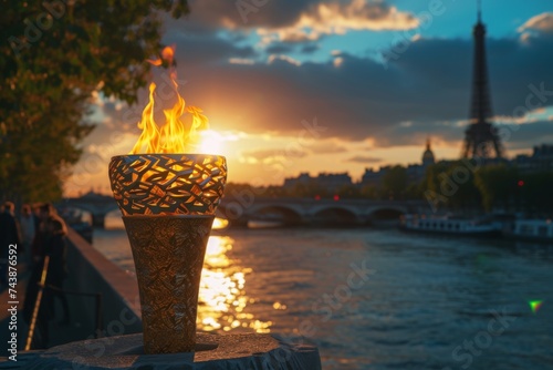  Olympic torch with intricate design details, captured with the Seine River and a Parisian sunset backdrop 