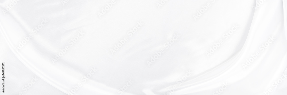 White gray satin texture that is white silver fabric silk background with beautiful soft blur pattern natural.