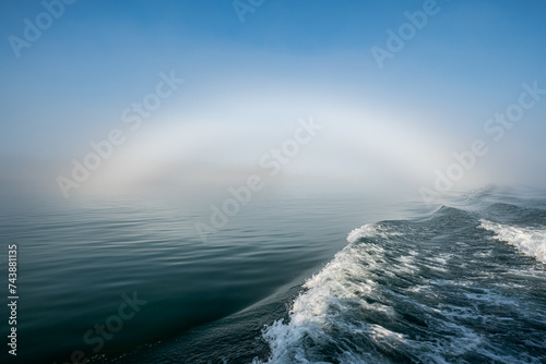 Foto Fogbow arch of fog over sea