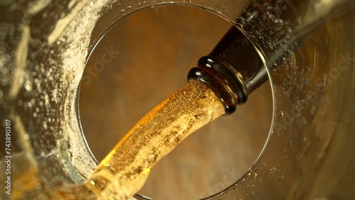 Macro Shot of Beer Pouring into Glass.
