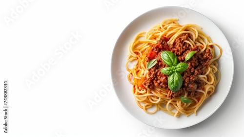 Spaghetti bolognese served on a white plate on a dark wooden background with tomatoes and basil