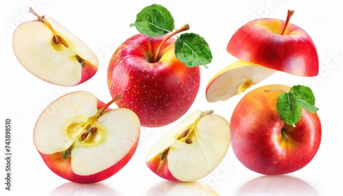 Apples isolated. Levitation of ripe red apples, apple halves and slices on a white background