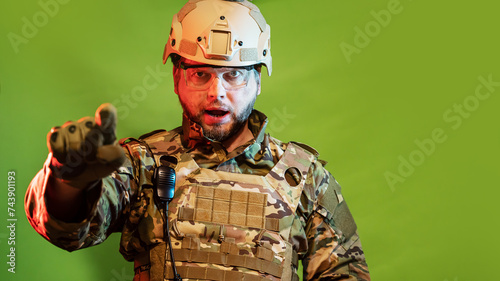 portrait of an American soldier in a dramatic light  with a gesture of conscription I want you