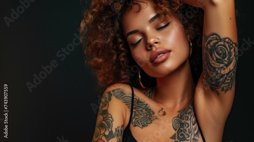 Close up of beautiful tattooed woman on color background, studio shot. Self expression.