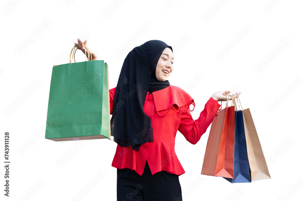 happy muslim arab lady happy enjoy shop in shopping walking street hand holding many paper shopping bag