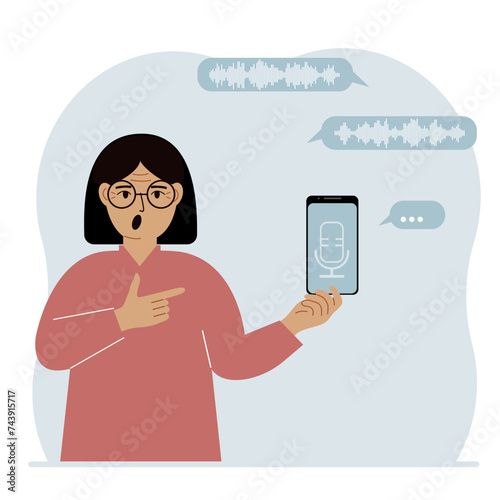 A woman holds a smartphone using a voice assistant application. Voice recognition concept. Smart speaker applications, office controller, hands-free phone calls, voice command software.