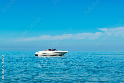 white motor boat at sea. place for text © Anton