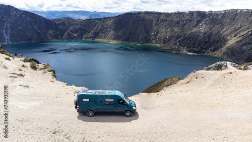 View of a campervan on the edge of a crater filled with water © JoseMaria