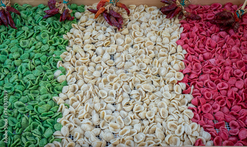 Close up on fresh raw orecchiette, typical apulian pasta, in downtown in Bari, Puglia region, southern Italy photo
