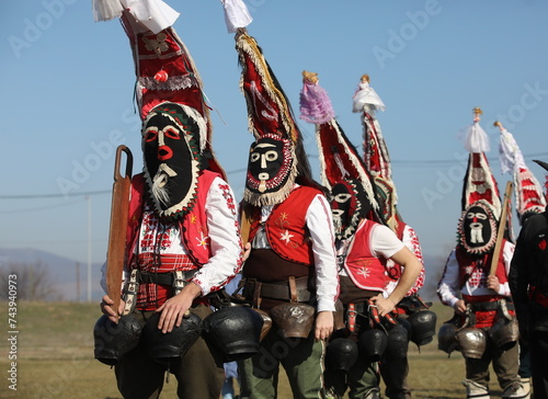 Bild auf Leinwand People called Kukeri parade in masks and ritual costumes, perform ritual dances to drive away evil spirits in the town of Elin Pelin, Bulgaria