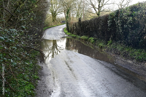 Flooded, muddy, slippery, dirty road in the UK after the heavy rains of February 22nd 2024. 
