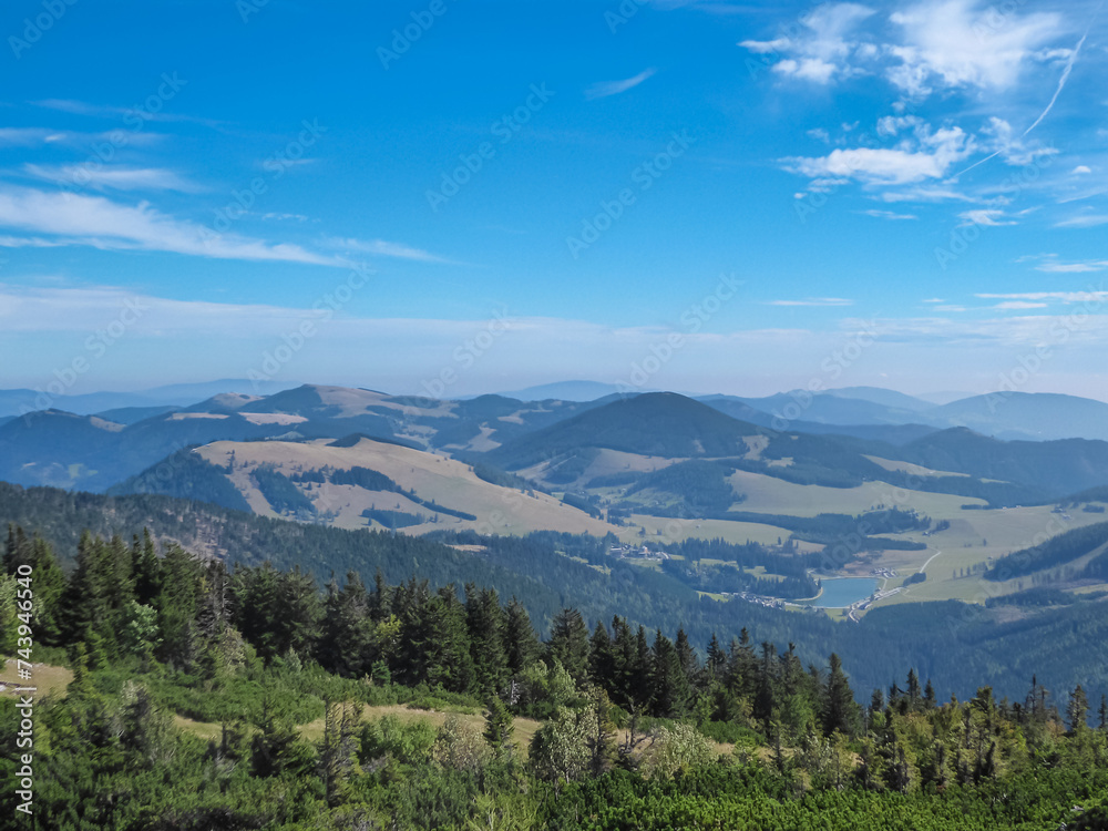 On top of majestic mountain peak Hochlantsch with panoramic view of lake at Teichalm, Graz Highlands, Prealps East of the Mur, Styria, Austria. Wanderlust Austrian Alps. Hiking trail in alpine nature