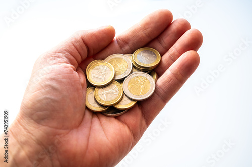 Hand holding some euro coins. Value of money and prices. 