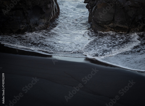 beach with black volcanic sand on  Tenerife photo