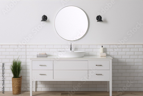 Bathroom vanity in a modern style with a white finish and a round mirror