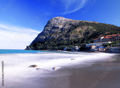 Beautiful landscape seacost with rocks at the sunny day new world long exposure