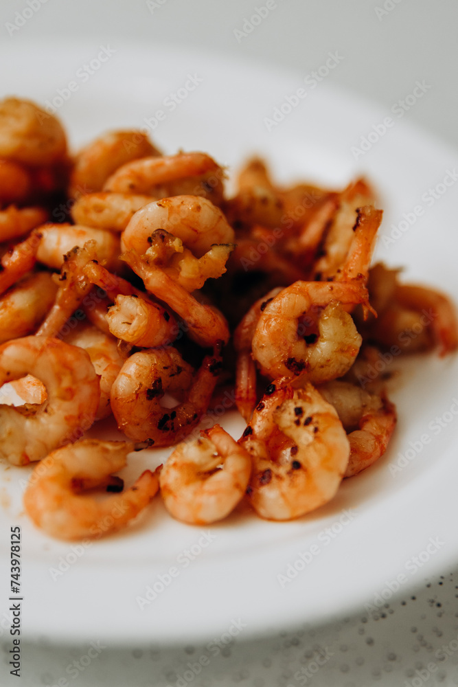Delicious shrimp and mussels. Seafood on a white plate Delicious shrimp and mussels. Seafood on a white plate