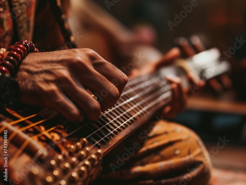 Close-up of hands playing a musical instrument during a live performance in a small venue