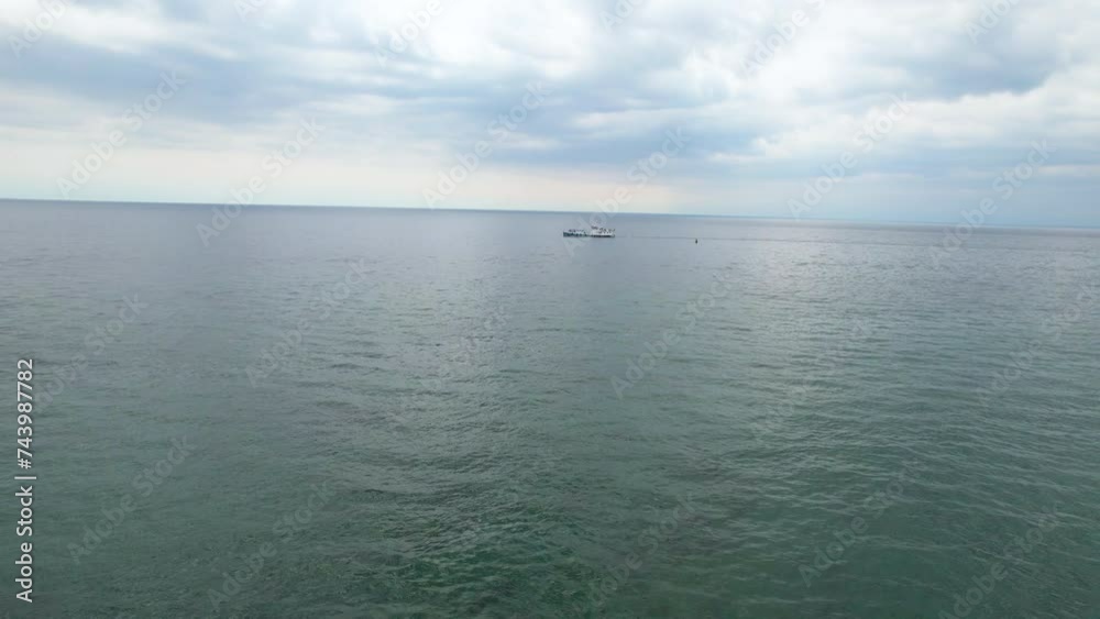 A ship with tourists is walking on the lake. Summer cruise, travel. A ship with tourists is walking on the lake. Summer cruise, travel.