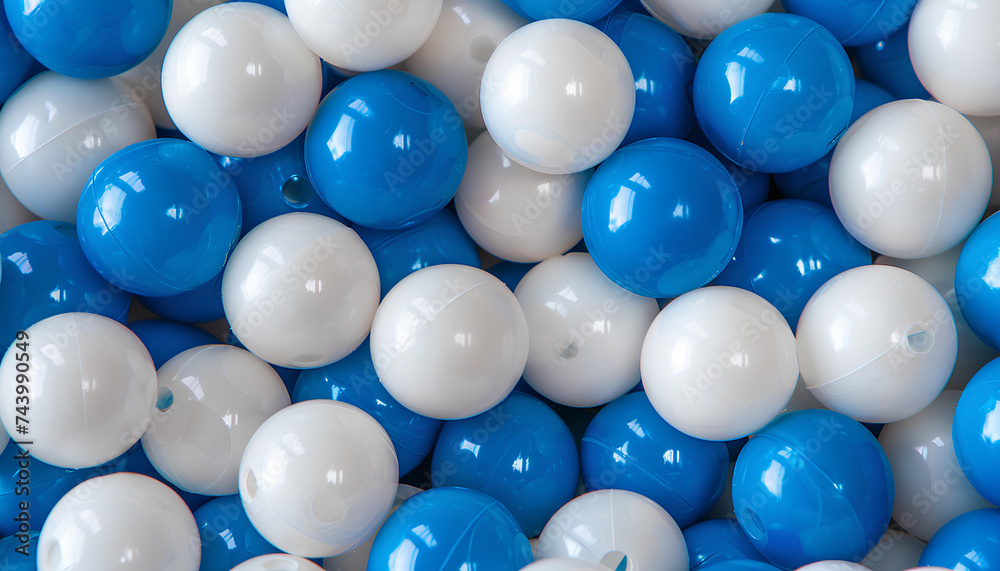 White and blue plastic balls selected for a ball pit