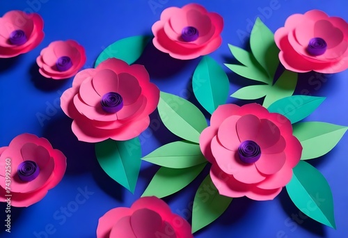 paper flowers with green leaves on a blue background