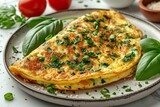 Omelette or frittatas with green onions or young greenery and mozzarella on white marble table background
