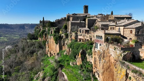 Civita di Bagnoregio, borgo turistico medievale sulla collina di tufo. Viterbo, Lazio Italia.
Veduta aerea di Bagnoregio,  la città che muore per via della roccia vulcanica che si sgretola, Calanchi. photo