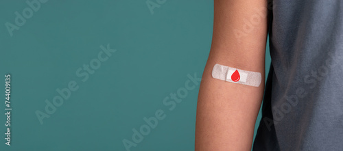 Фотография Arm with plaster, blood cells, donate plasma, world blood donor day, health care