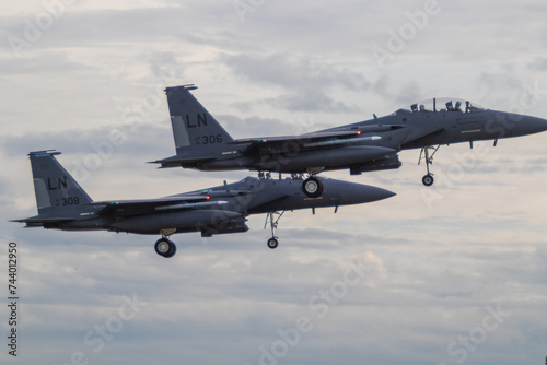 Two F15 fighter jets with landing gear down coming in to land at RAF Lakenheath photo